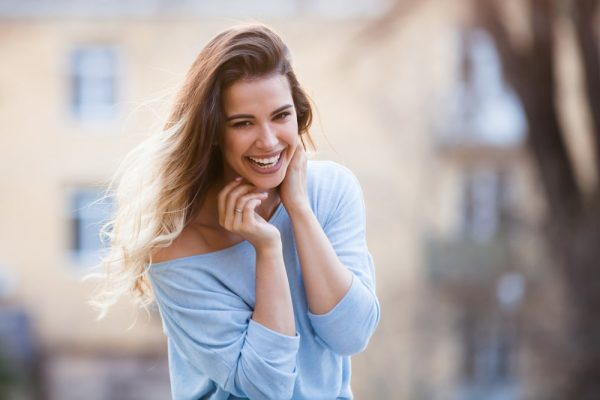 Outdoors,Portrait,Of,Beautiful,Young,Girl,Laughing
